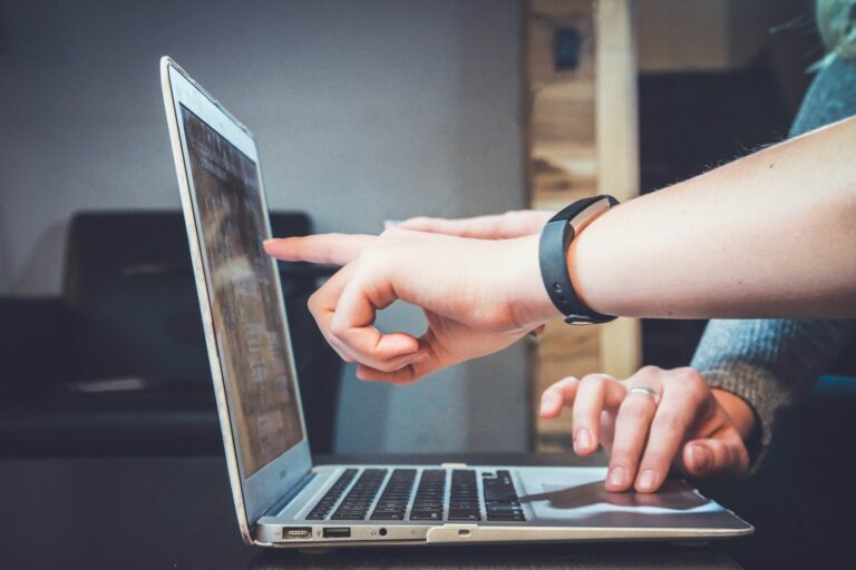 An open laptop on a desk, representing the connection between physical activity and a digital customer journey.
