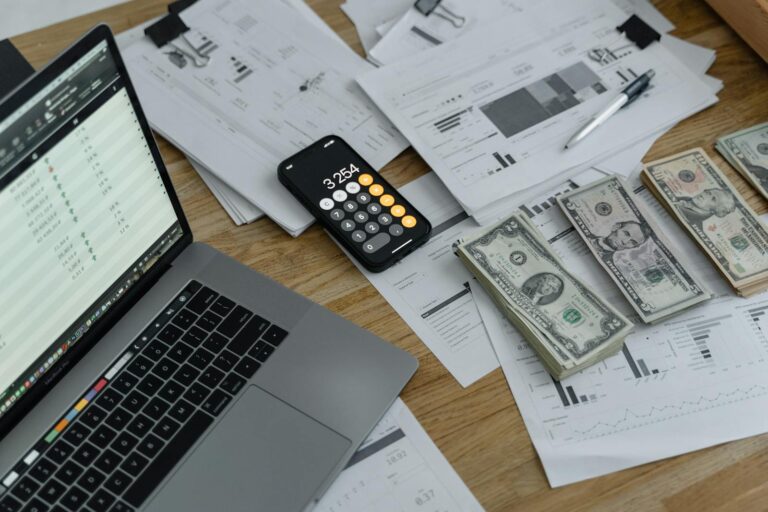 Notebook, calculator, and cards on a desk, representing credit system planning.