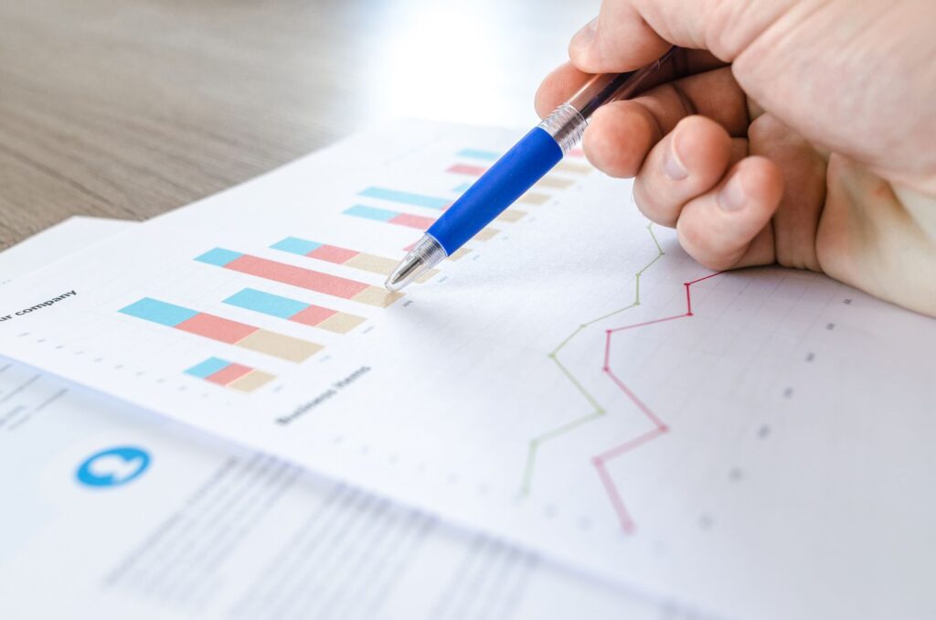 Charts and data on a computer screen, representing demand signal detection before competitors react.